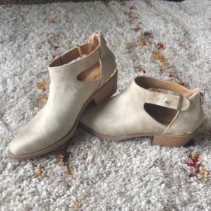 Rustic cream colored cut out ankle bootie.